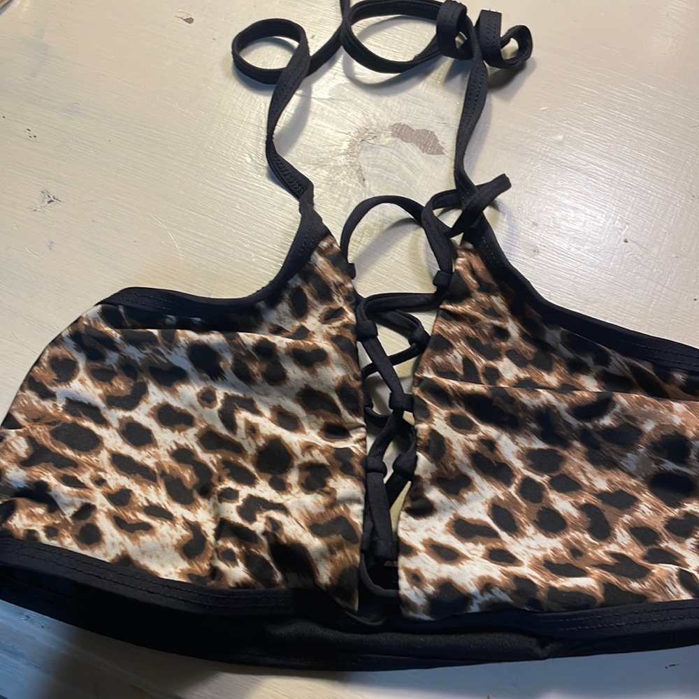 Bathing suit top by Gianni bini. Leopard print with a tie up front.